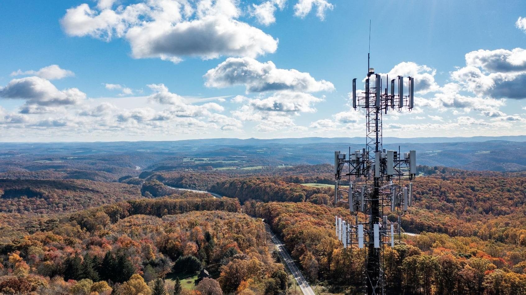 Macro cell site on a wooded ridge, viewed from the air